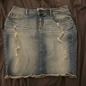 Light distressed denim skirt.